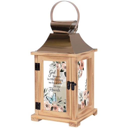 Decorative lantern with floral design and text on a white background