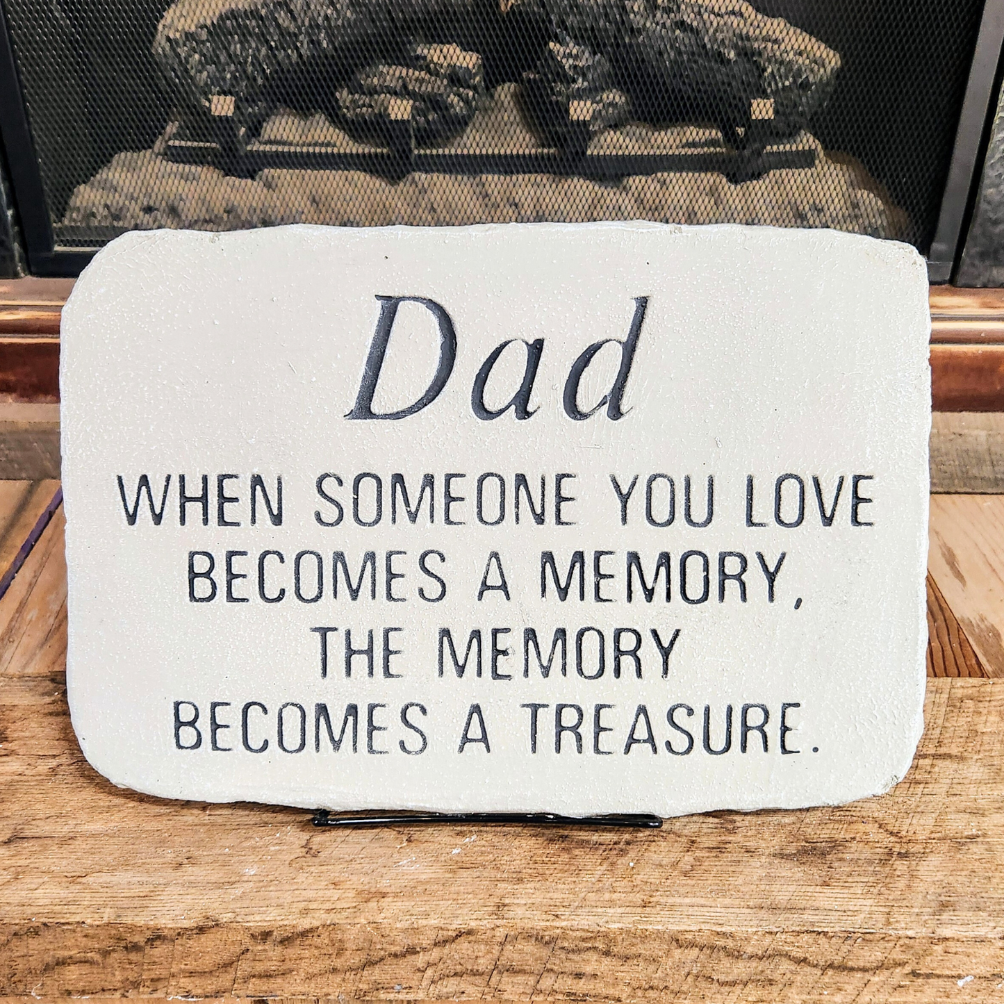Rectangular gray concrete memorial stone with engraved message for a father, displayed with a stand.