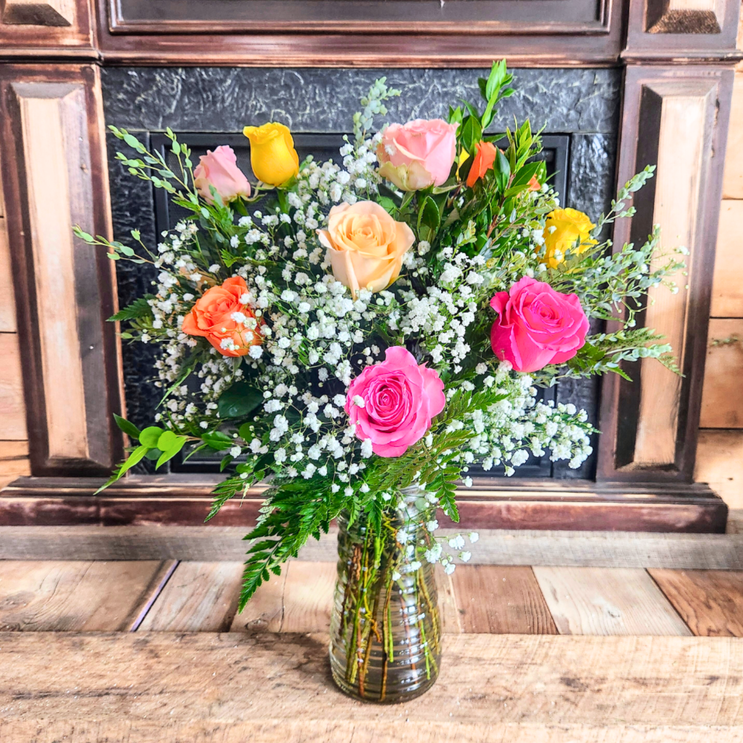 Full dozen mixed rose bouquet in a vase for the National Sweetheart Pageant during the National Sweet Corn Festival in Hoopeston, Illinois.