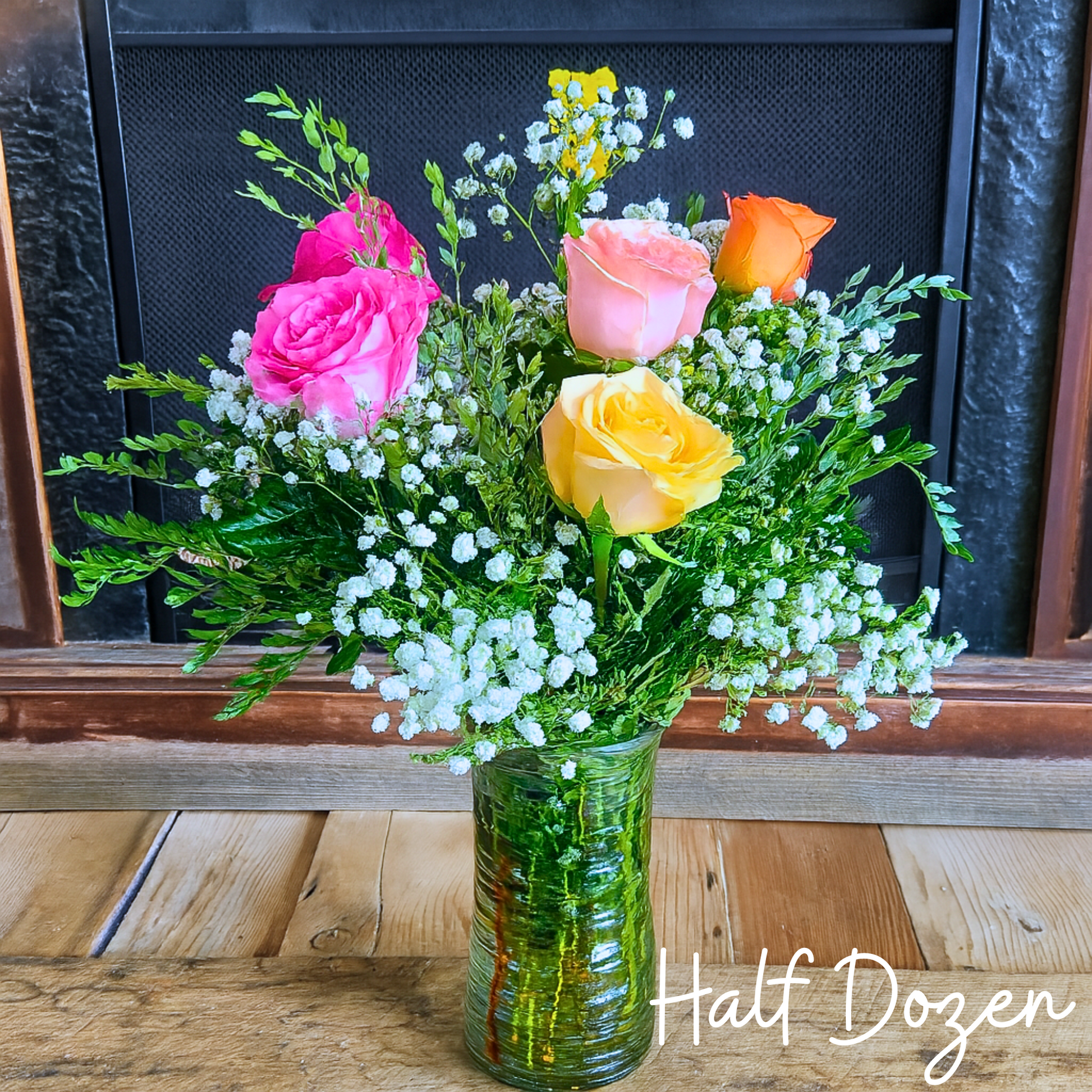 Half dozen mixed rose bouquet in a vase for the National Sweetheart Pageant during the National Sweet Corn Festival in Hoopeston, Illinois.