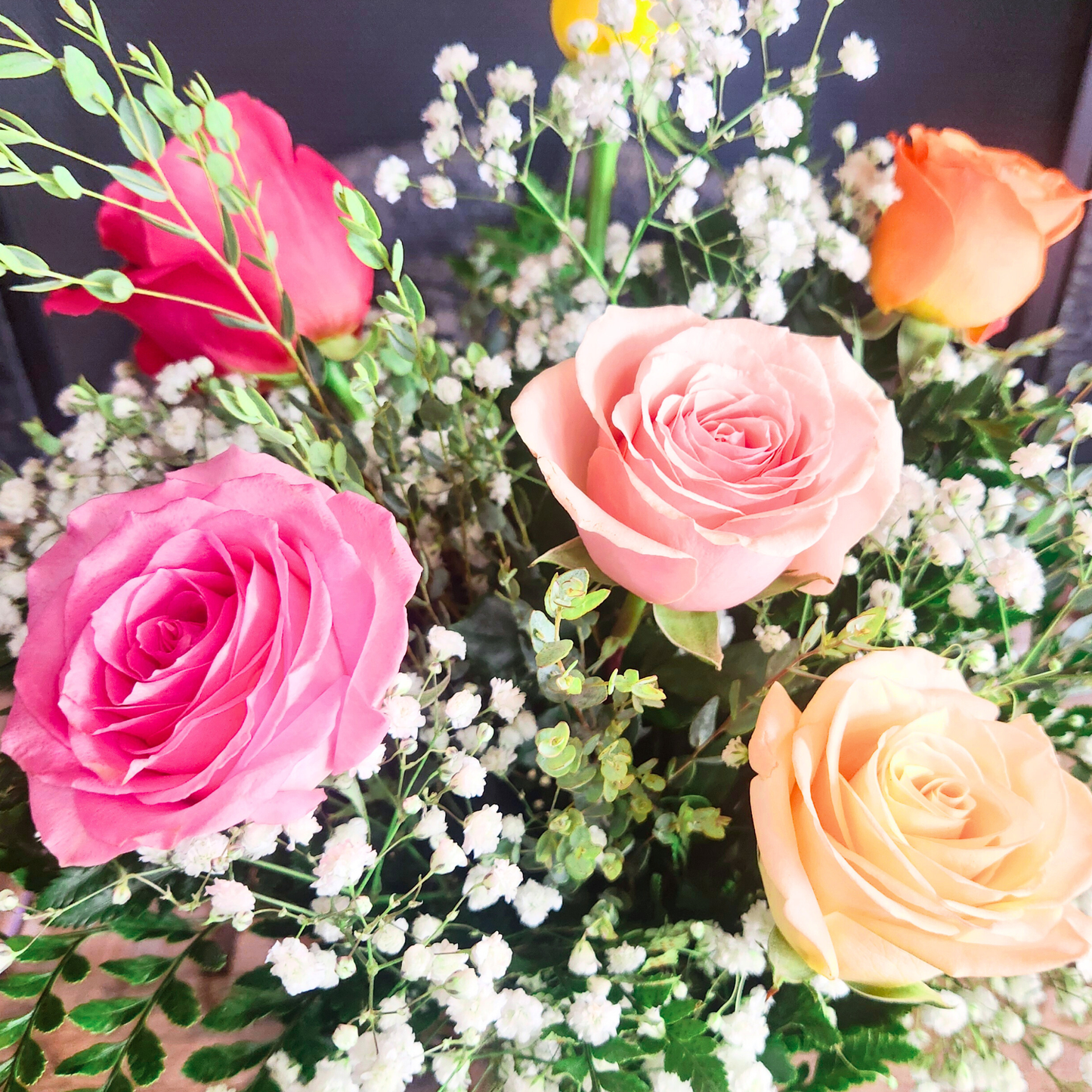 Half dozen mixed rose bouquet in a vase for the National Sweetheart Pageant during the National Sweet Corn Festival in Hoopeston, Illinois.