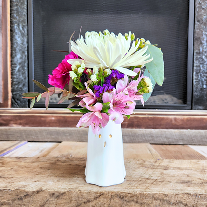 Boo-tiful Blooms fall arrangement with white, pink, purple, and green seasonal flowers in a white ghost vase from Treasured Roots Flower Shop in Hoopeston, IL.