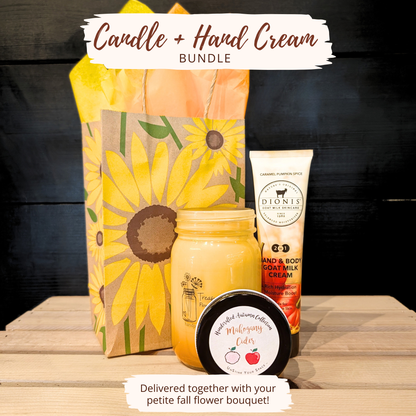 Fall gift bundle with a Treasured Roots soy mason jar candle, Dionis Caramel Pumpkin Spice hand and body cream, sunflower gift bag, and tissue paper.